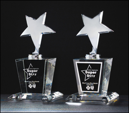 Chrome-plated metal star mounted on crystal base, black and silver aluminum plate included