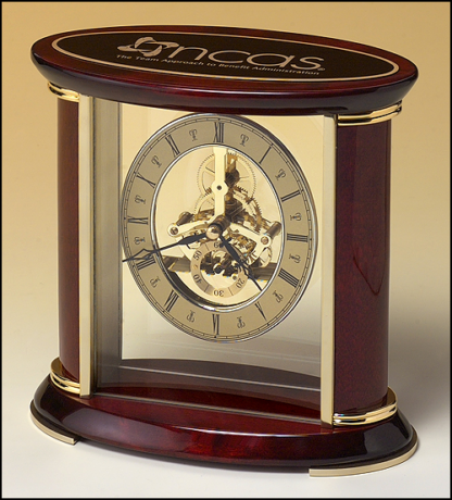 Skeleton clock with sub-second dial, brass finished movement and rosewood piano finish accents.