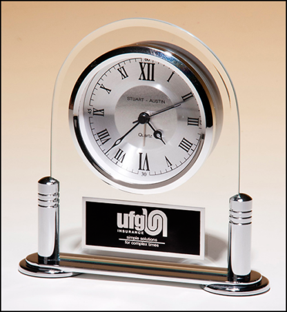 Desk clock with beveled glass upright and silver metal base, three hand clock movement