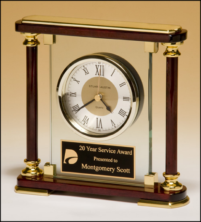 Traditional glass and rosewood piano-finish clockwith gold metal accents.