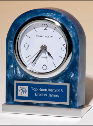 Acrylic clock with polished silver aluminum base.  Silver bezel, white dial, three-hand movement.