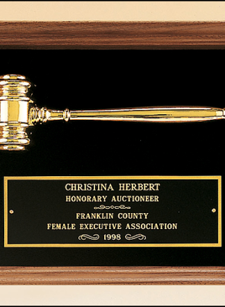 American walnut frame with a gold electroplated metal gavel on choice of velour backgrounds.